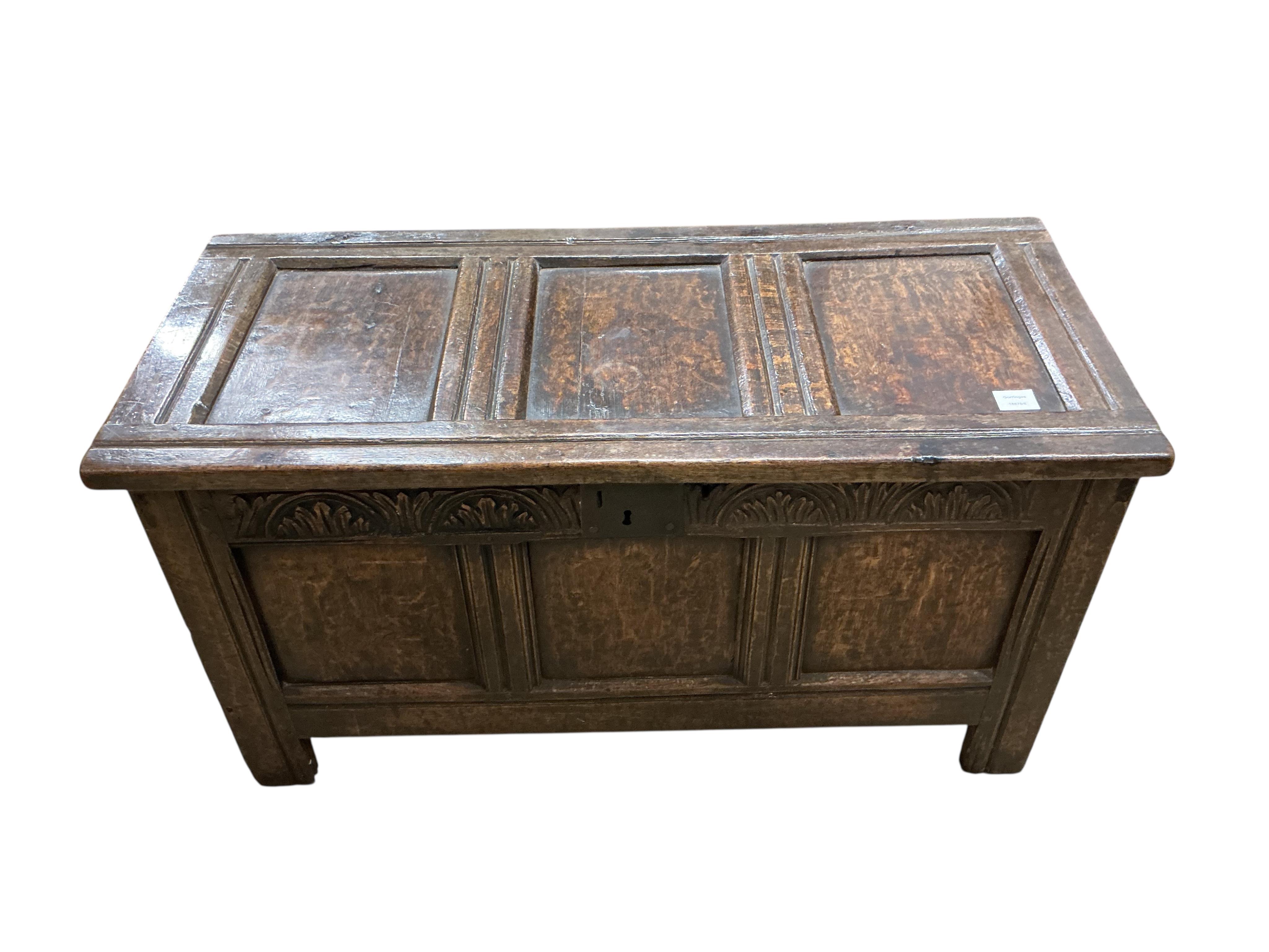 A small 17th century oak triple panelled coffer, width 106cm, depth 46cm, height 59cm